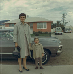 Marj and Earl on curb at 32 McKenzie Crescent, late 1960's. Fennel's house behind.