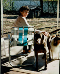 Marj in backyard with Queenie and Jessie, Stillwater, OK, Feb., 1996.