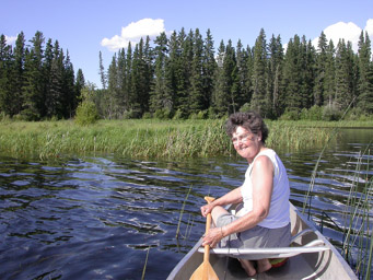 Marj, canoing in Waskesiu Lake at the mouth of the Kingsmere River, July, 2005.