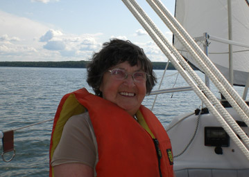 Mom sailing with Dal Tiffin.