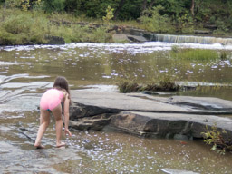 Trying to not slip on the rocks. Note the bottom is still clean.
