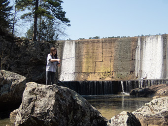 Jeralyn casting below the dam.